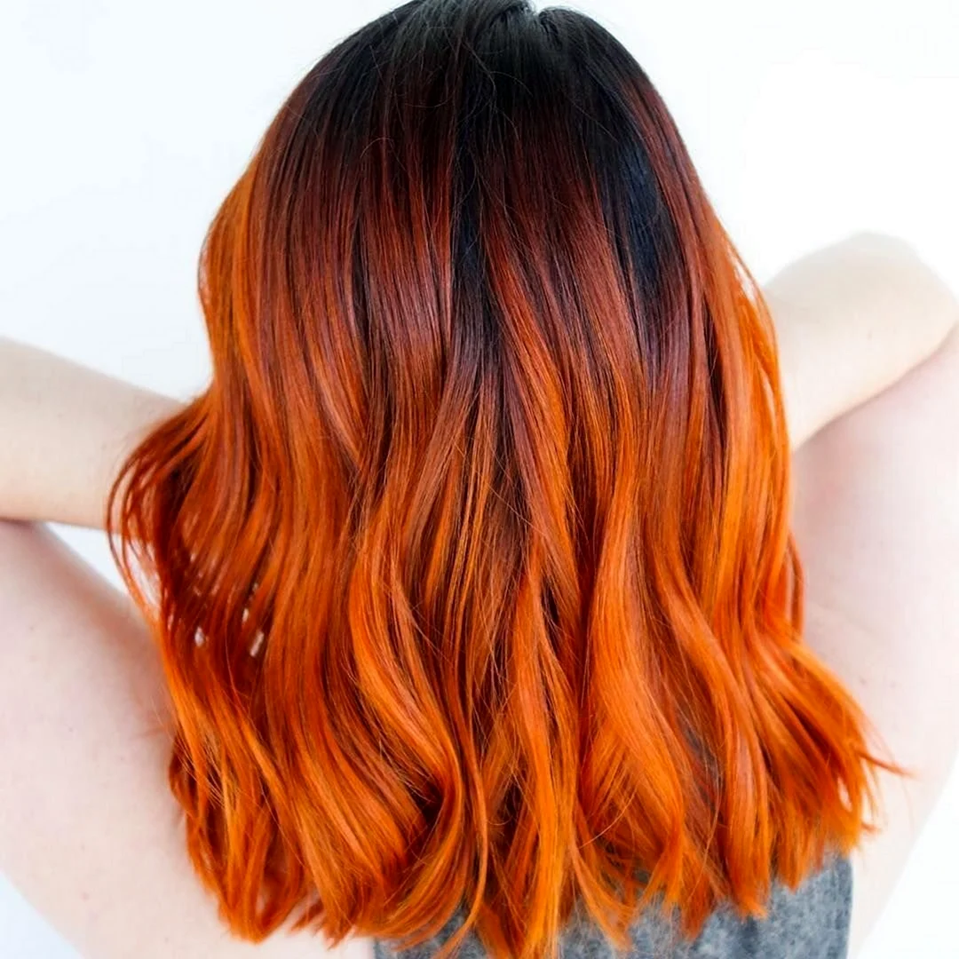 Оранжевые пряди на темных волосах
